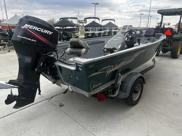 Slide: The Image of 2005 Lund 16 REBEL boat with Mercury FourStroke EFI engine on trailer. - 7