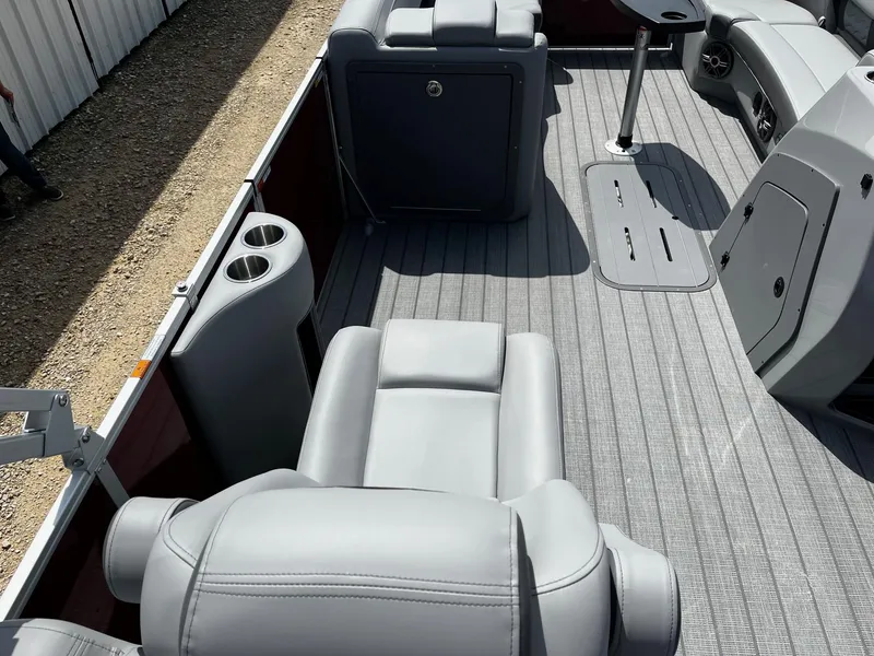 Slide: The Image of Luxurious interior of 2025 SunCatcher Fusion 322RC pontoon boat with plush seating and cup holders. - 11