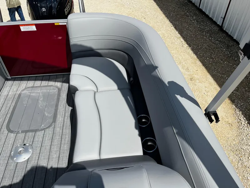 Slide: The Image of Luxurious seating on 2025 SunCatcher Fusion 322RC boat with gray upholstery and cup holders. - 13
