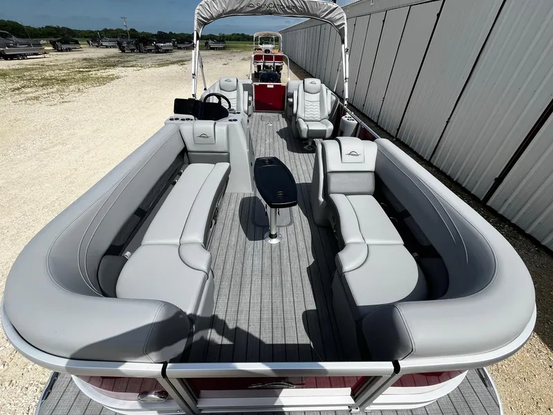 Slide: The Image of 2025 SunCatcher Fusion 322RC pontoon boat with spacious seating and modern design. - 8