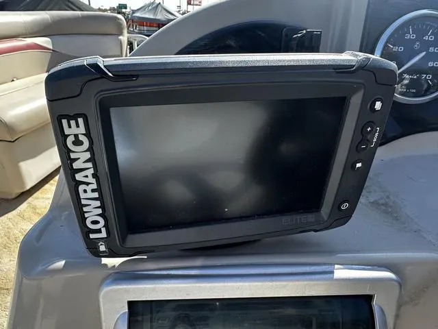 Slide: The Image of Lowrance Elite fishfinder on 2012 Godfrey Sweetwater boat dashboard. - 15