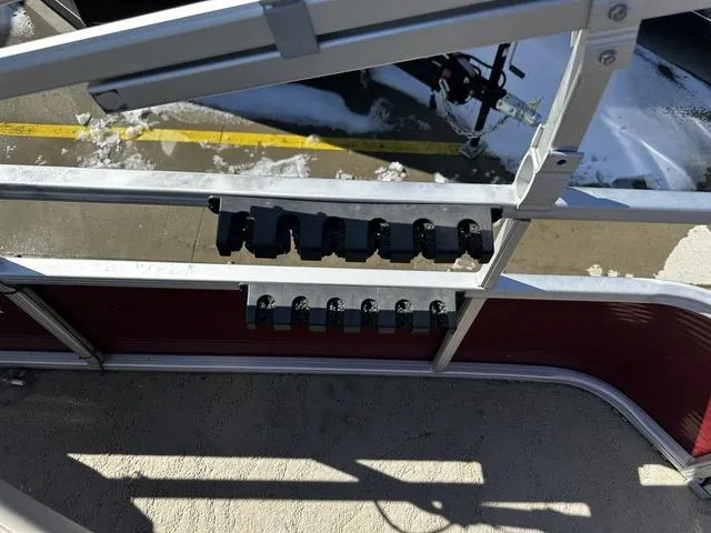 Slide: The Image of 2012 Godfrey Sweetwater boat railing with rod holders, snowy background. - 18