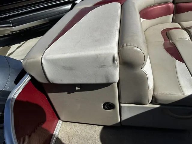 Slide: The Image of 2012 Godfrey Sweetwater boat seat with red and beige upholstery. - 19