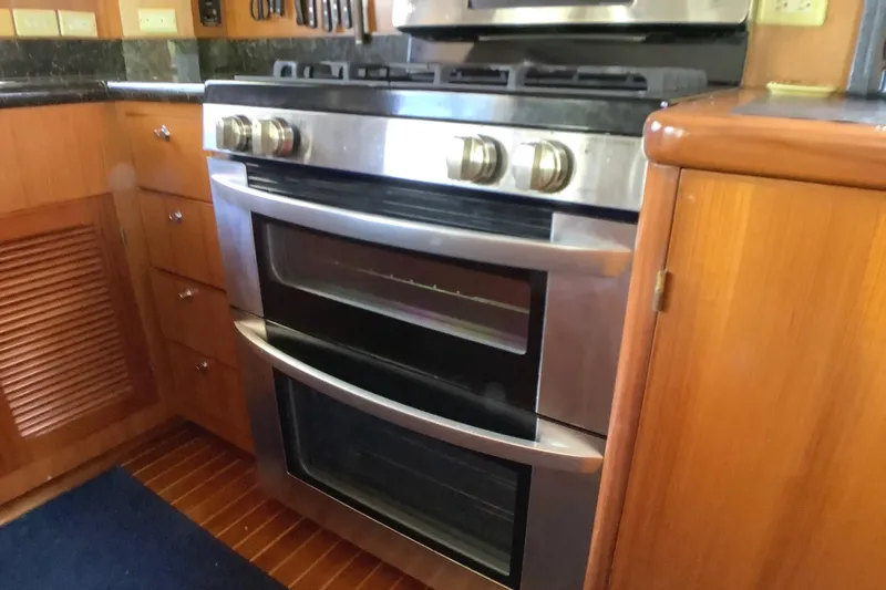 Slide: The Image of Stainless steel oven in 1998 Grand Alaskan 60 Pilothouse yacht kitchen. - 20