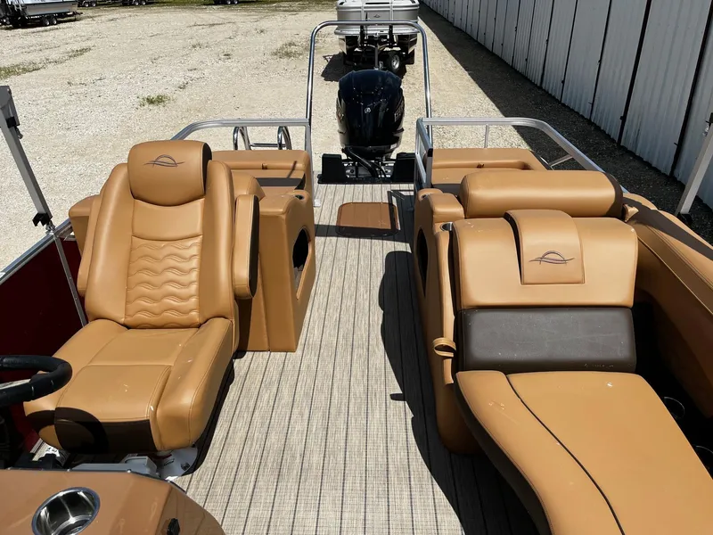 Slide: The Image of 2025 SunCatcher Fusion 324SS pontoon boat with tan leather seating and modern design. - 10