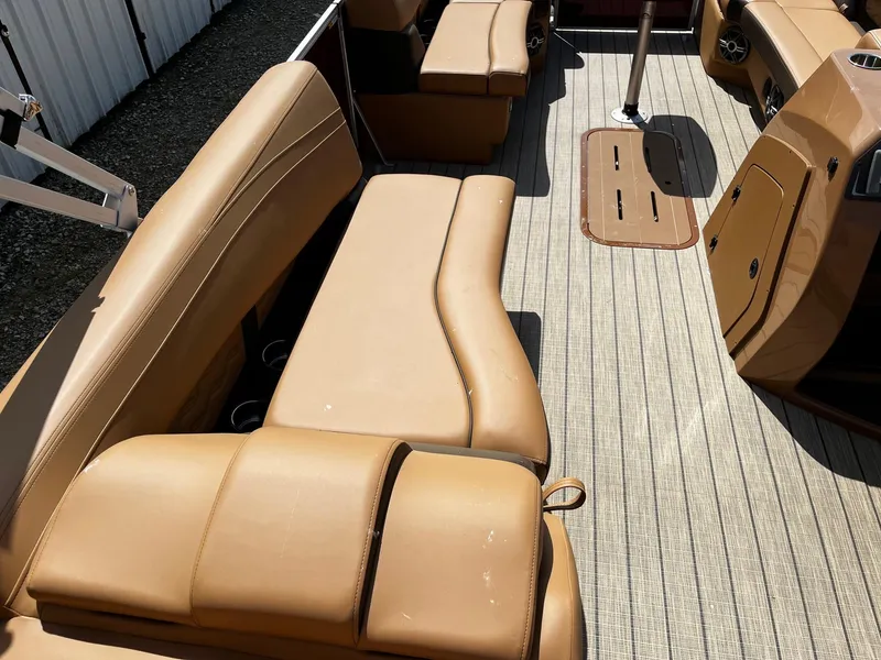 Slide: The Image of Luxurious seating on 2025 SunCatcher Fusion 324SS boat with tan upholstery. - 11