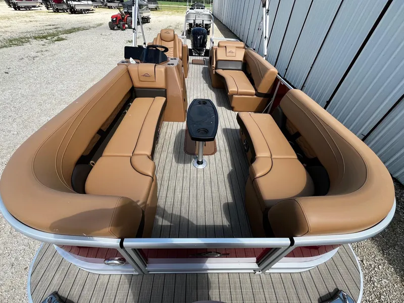 Slide: The Image of 2025 SunCatcher Fusion 324SS pontoon boat with spacious tan seating and modern design. - 8