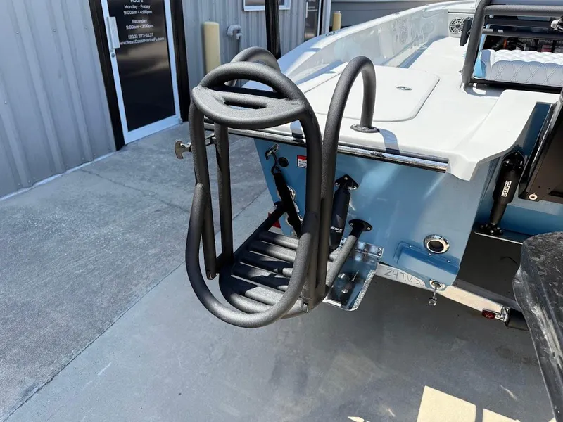 Slide: The Image of 2025 Shallow Sport 24 Modified V boat with a rear boarding ladder. - 11