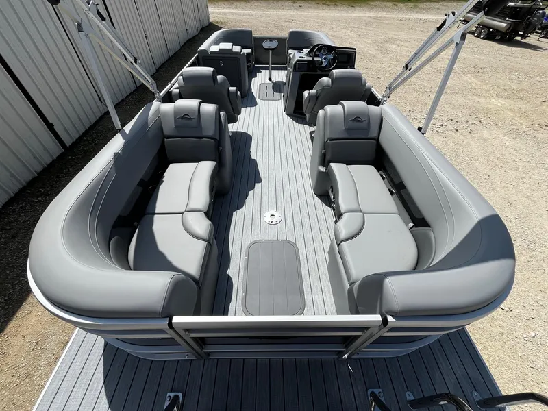 Slide: The Image of 2025 SunCatcher Fusion 324RC pontoon boat with spacious gray seating and modern design. - 9