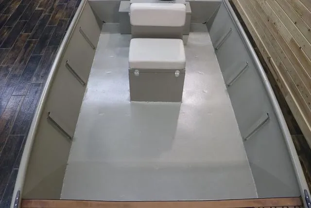 Slide: The Image of 2023 XTREME BOATS Brute 1754 CC interior with seating and storage. - 11