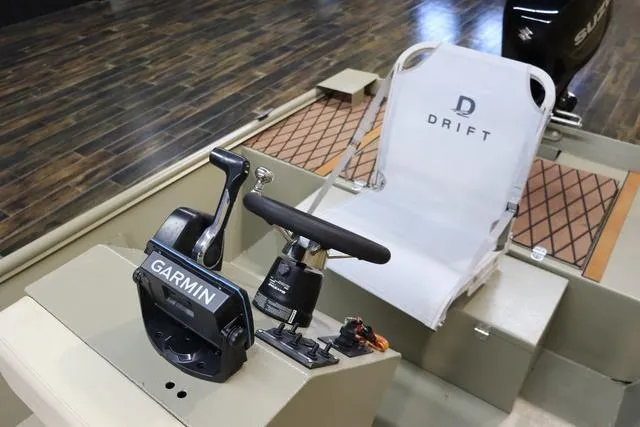 Slide: The Image of 2023 XTREME BOATS Brute 1754 CC interior with Garmin controls and Drift seat. - 13