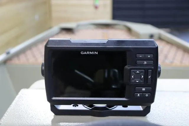 Slide: The Image of Garmin device on 2023 XTREME BOATS Brute 1754 CC dashboard, showcasing navigation technology. - 16