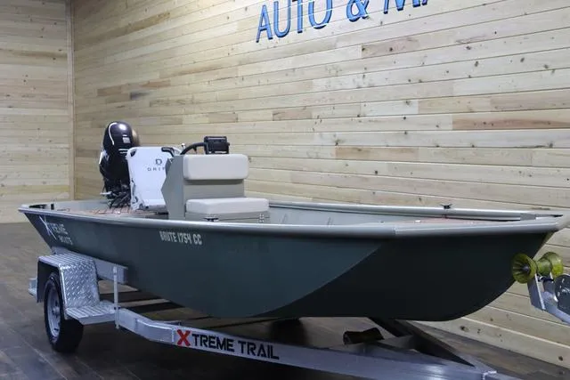 Slide: The Image of 2023 XTREME BOATS Brute 1754 CC on trailer, displayed indoors with wooden walls. - 3