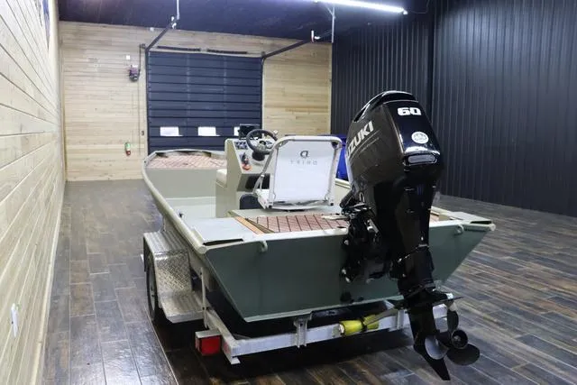 Slide: The Image of 2023 XTREME BOATS Brute 1754 CC with Suzuki 60 engine in a wooden garage. - 6