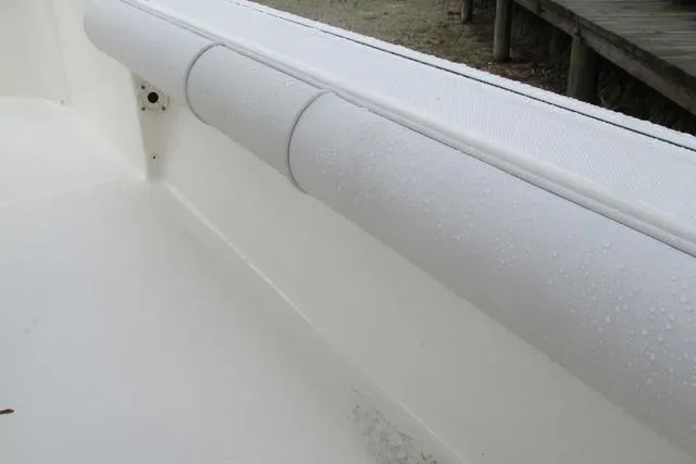 Slide: The Image of 2023 Sea Born FX22 boat interior with white cushioned side panel. - 21