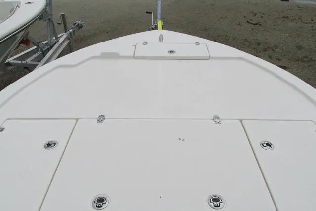 Slide: The Image of 2023 Sea Born FX22 boat deck with storage compartments and trailer. - 26
