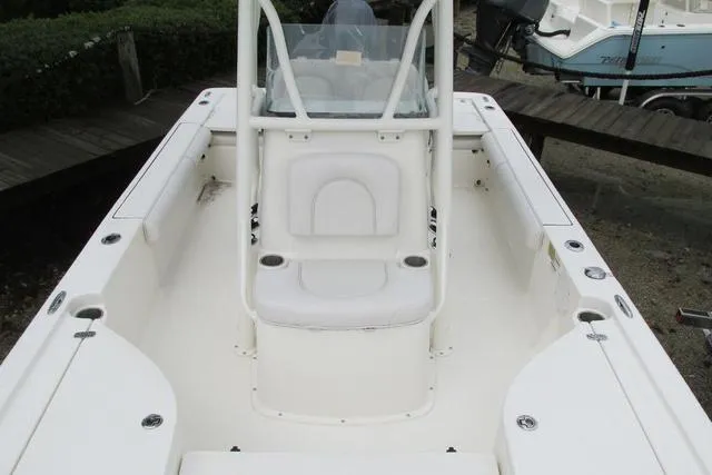 Slide: The Image of 2023 Sea Born FX22 boat interior with white seating and console. - 27