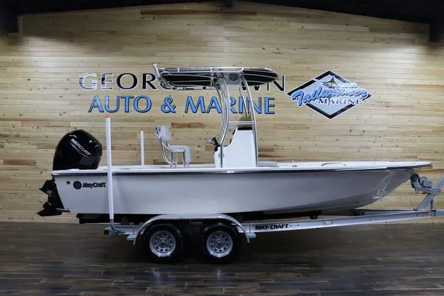 Slide: The Image of 2023 May-Craft 2200 Bay boat on trailer at dealership showroom. - 1