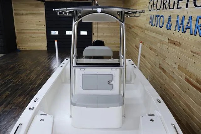 Slide: The Image of 2023 May-Craft 2200 Bay boat interior with center console and wooden showroom. - 10