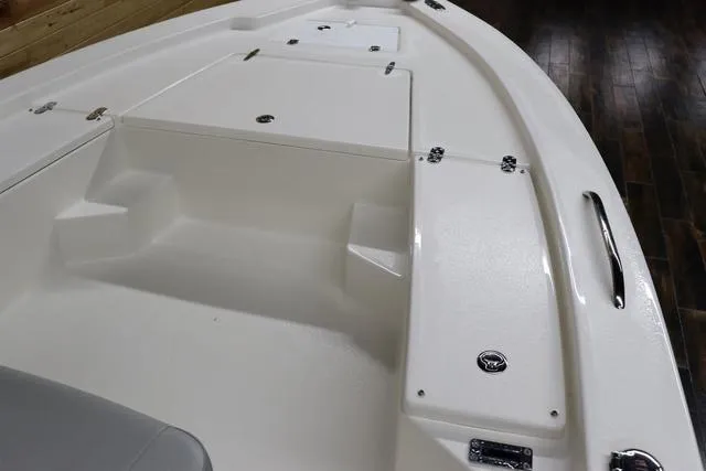 Slide: The Image of 2023 May-Craft 2200 Bay boat interior with storage compartments and seating. - 17