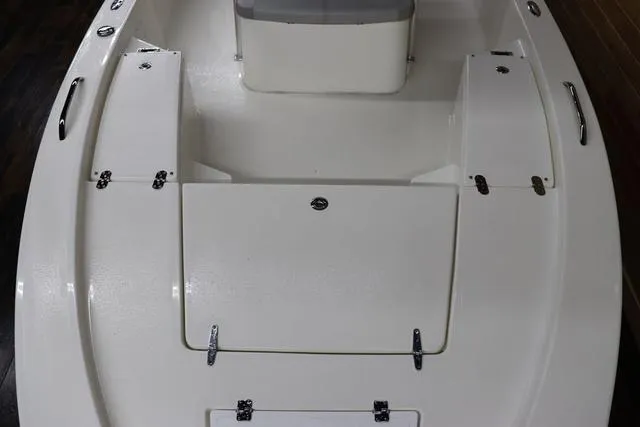 Slide: The Image of 2023 May-Craft 2200 Bay boat interior with storage compartments and seating. - 9