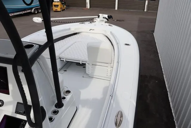 Slide: The Image of 2025 Yellowfin 26 Hybrid boat interior with white seating and control panel. - 14