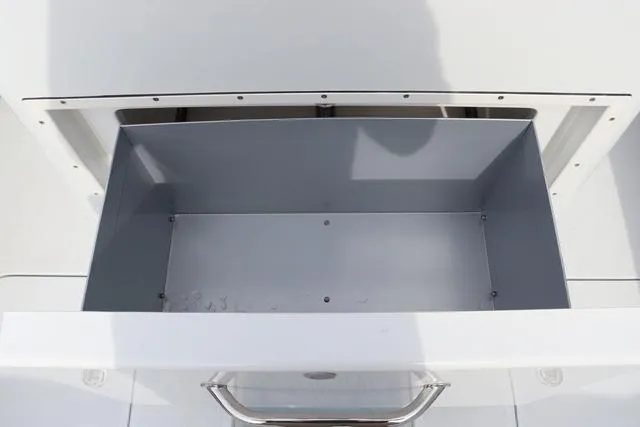 Slide: The Image of Open storage compartment on 2025 Yellowfin 26 Hybrid boat. - 15