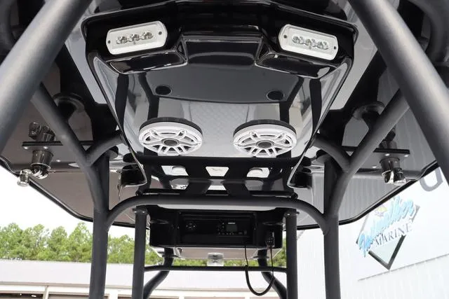 Slide: The Image of 2025 Yellowfin 26 Hybrid boat with advanced audio and lighting system, viewed from below. - 17