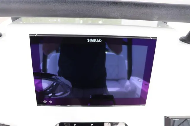 Slide: The Image of Simrad display on 2025 Yellowfin 26 Hybrid boat dashboard. - 18