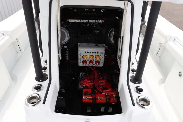 Slide: The Image of 2025 Yellowfin 26 Hybrid boat engine compartment with batteries and control panel. - 24