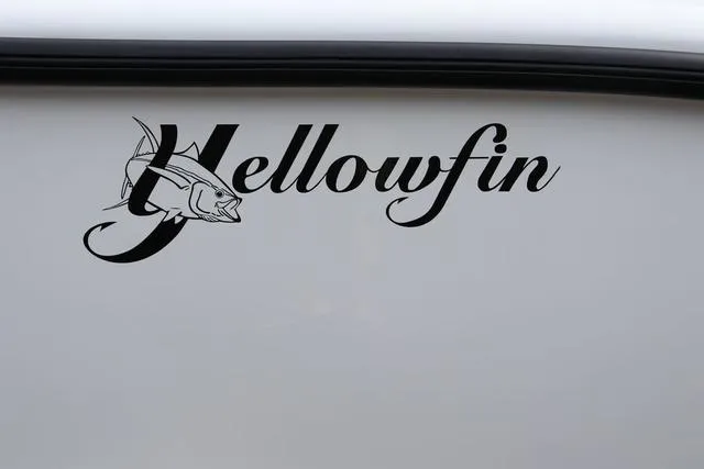 Slide: The Image of Yellowfin 26 Hybrid 2025 logo on boat exterior, featuring stylized fish design. - 5