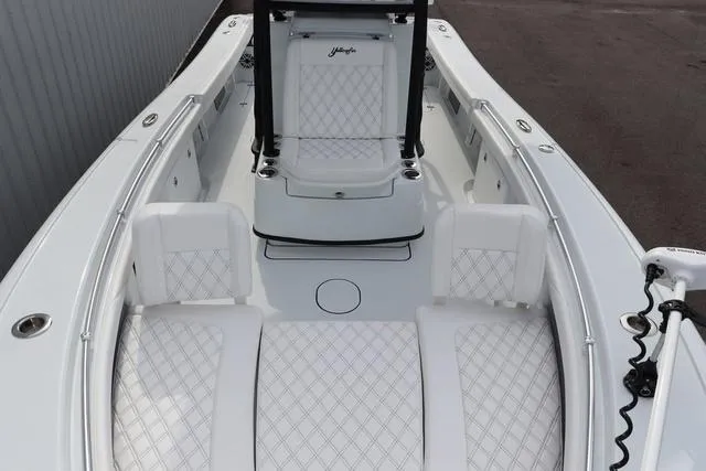Slide: The Image of 2025 Yellowfin 26 Hybrid boat interior with white quilted seating and sleek design. - 8