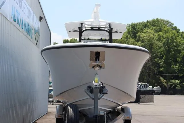 Slide: The Image of 2025 Yellowfin 32 boat on trailer, parked outdoors near a building. - 21