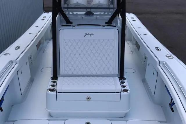 Slide: The Image of 2025 Yellowfin 32 boat interior with white seating and sleek design. - 8