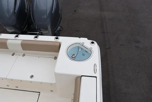 Slide: The Image of 2023 Sea Born LX26 boat with dual engines and seating area. - 11