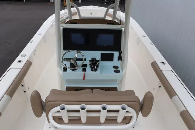Slide: The Image of 2023 Sea Born LX26 boat interior with dual screens and steering console. - 12