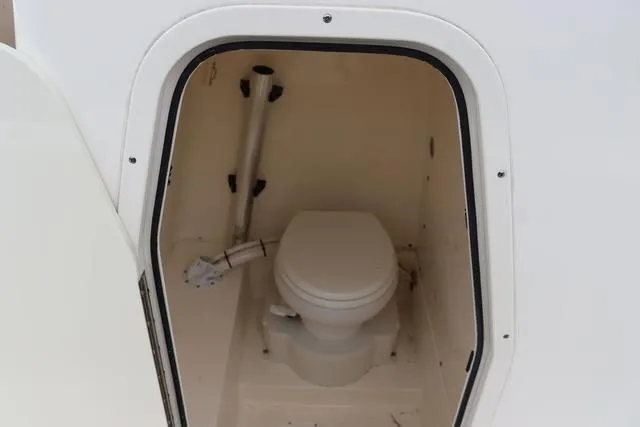Slide: The Image of 2023 Sea Born LX26 boat interior with compact marine toilet. - 23