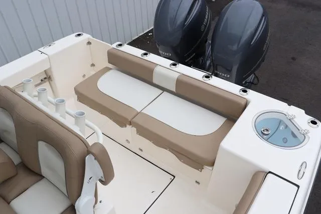 Slide: The Image of 2023 Sea Born LX26 boat interior with dual engines and seating area. - 24