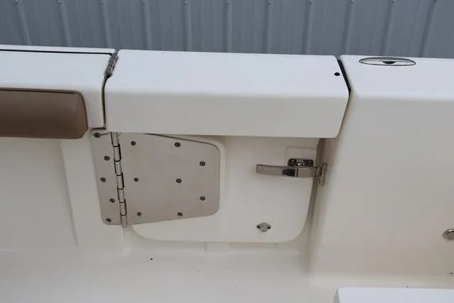 Slide: The Image of 2023 Sea Born LX26 boat interior detail with stainless steel latch and hinge. - 26