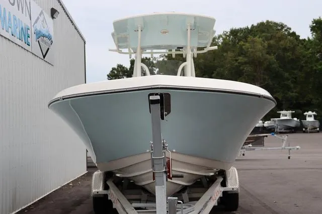 Slide: The Image of 2023 Sea Born LX26 boat on trailer, parked at a marine dealership. - 4