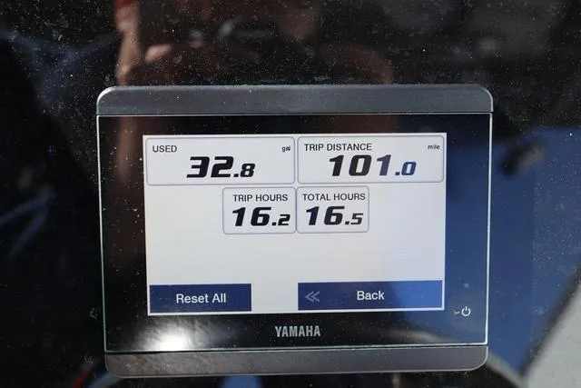 Slide: The Image of Digital display showing fuel usage and trip data for a 2023 Sea Pro 219 Deep V Series boat. - 11