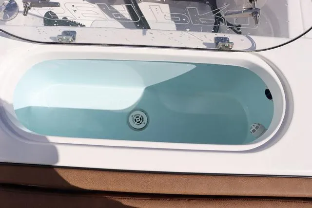 Slide: The Image of 2023 Sea Pro 219 Deep V Series livewell with clear lid and water inside. - 23