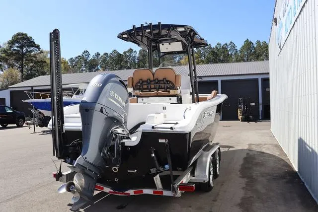 Slide: The Image of 2023 Sea Pro 219 Deep V Series boat with Yamaha engine, parked outdoors. - 5