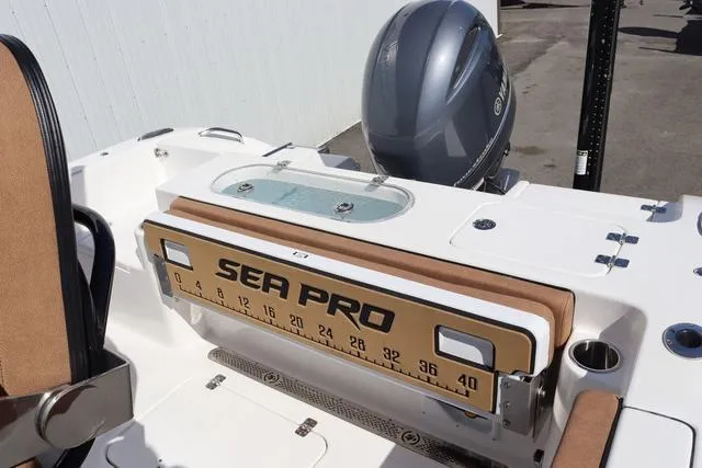 Slide: The Image of 2023 Sea Pro 219 Deep V Series boat with measuring board and motor. - 8