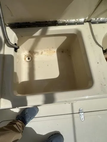 Slide: The Image of Open storage compartment on 1997 Sea Pro 255 WA boat deck. - 11