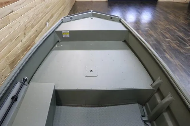 Slide: The Image of 2025 War Eagle 548LDV boat interior with wooden wall and floor background. - 5