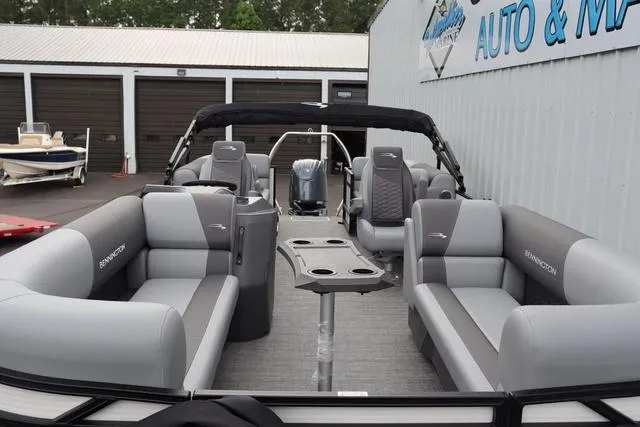 Slide: The Image of 2024 Bennington 22 SSR-SPS pontoon boat with gray seating and modern design. - 13