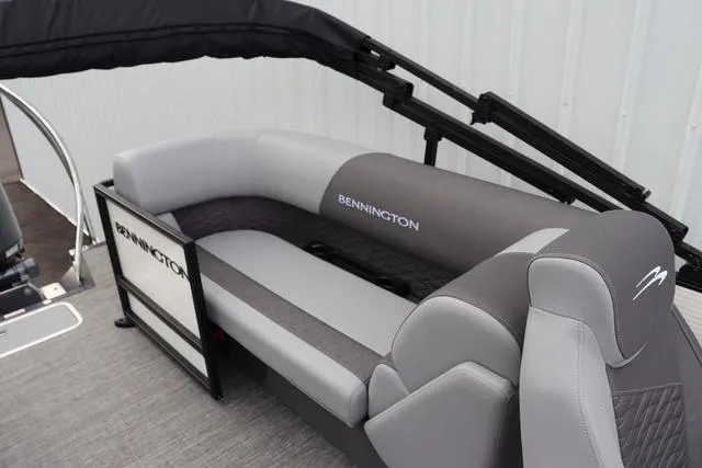 Slide: The Image of 2024 Bennington 22 SSR-SPS pontoon boat with gray seating and sleek design. - 18