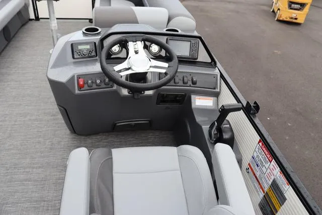 Slide: The Image of 2024 Bennington 22 SSR-SPS boat dashboard with steering wheel and controls. - 20