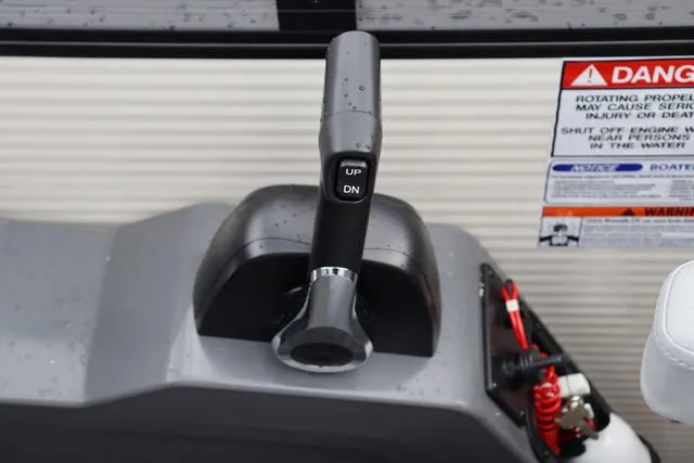 Slide: The Image of Throttle control of 2024 Bennington 22 SSR-SPS boat with warning labels visible. - 24